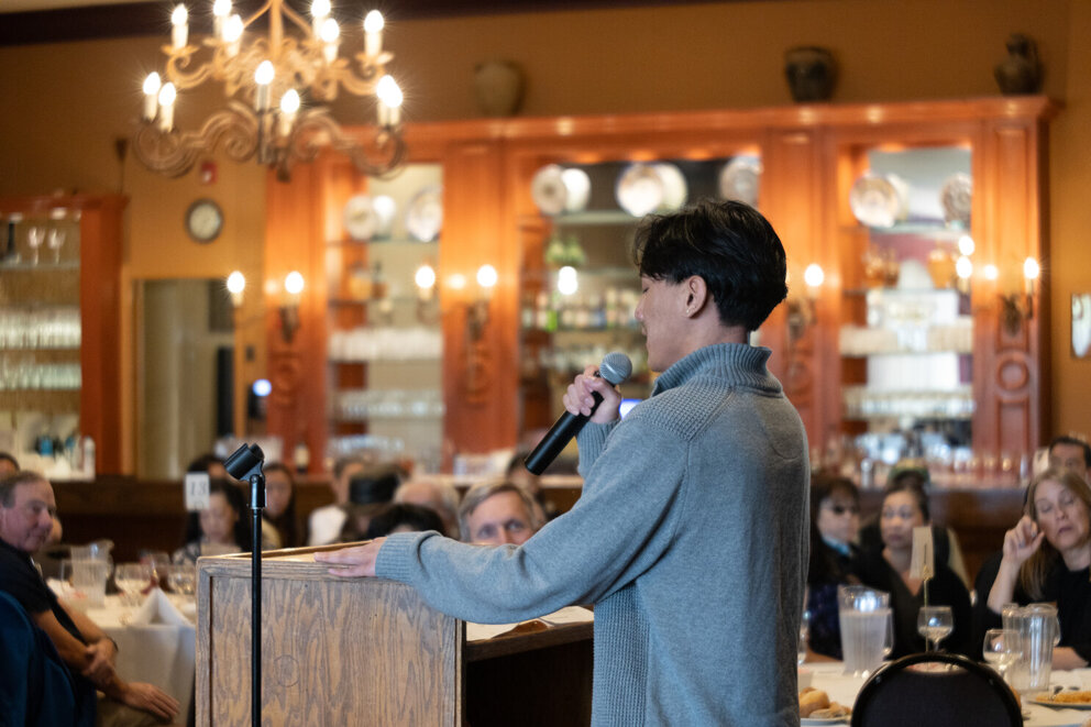a man speaking into a microphone