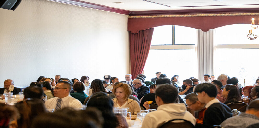 a group of people sitting at tables