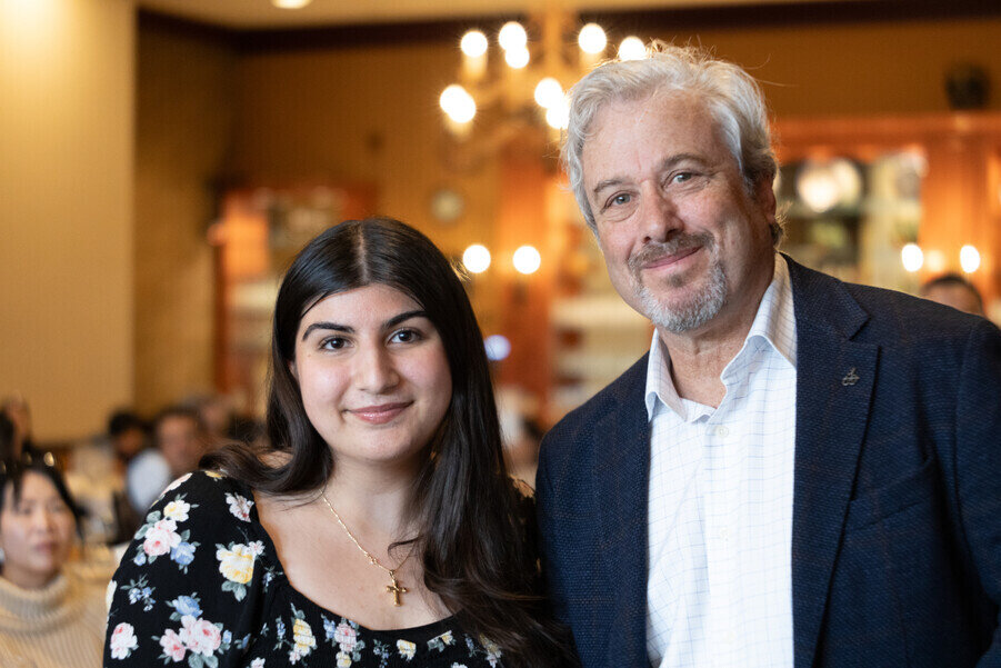 a man and woman smiling for a picture