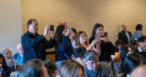 a group of people taking a selfie