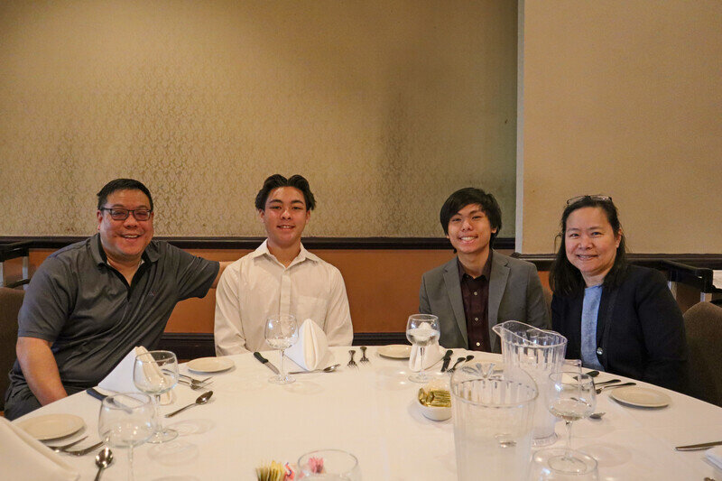 a group of people sitting at a table