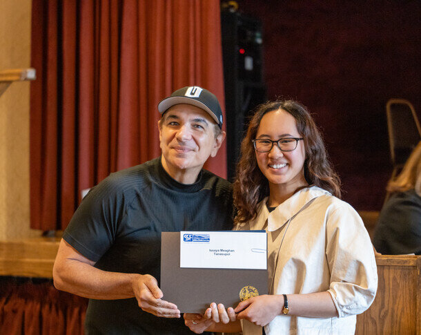 a man and woman holding a box