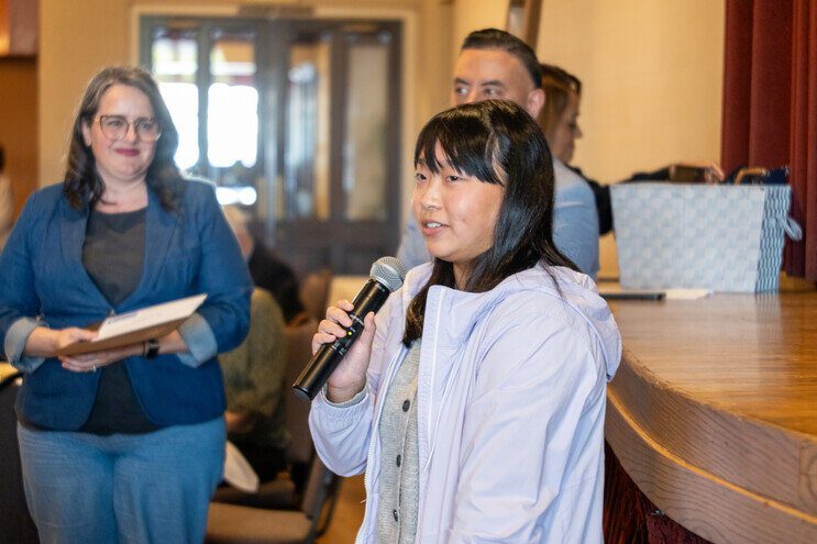 a woman holding a microphone