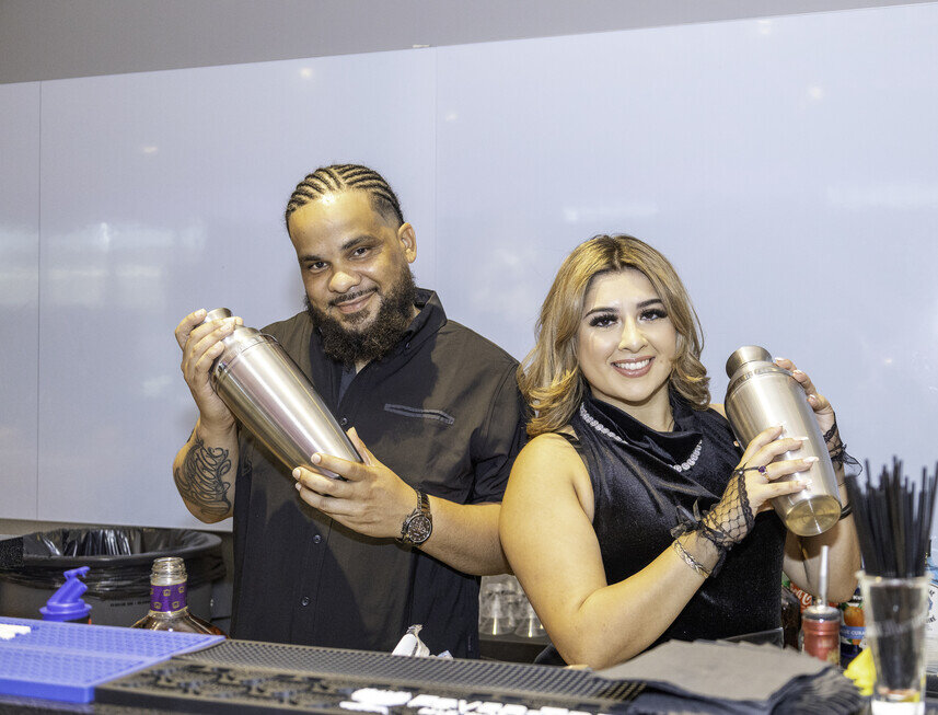 a man and woman holding drinks