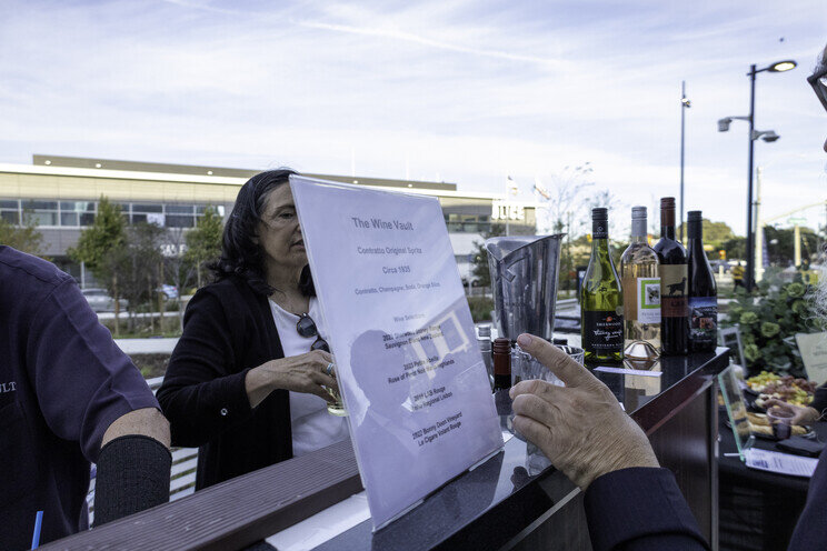 a woman standing at a bar