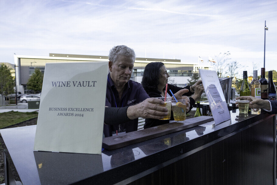 a man and woman holding drinks
