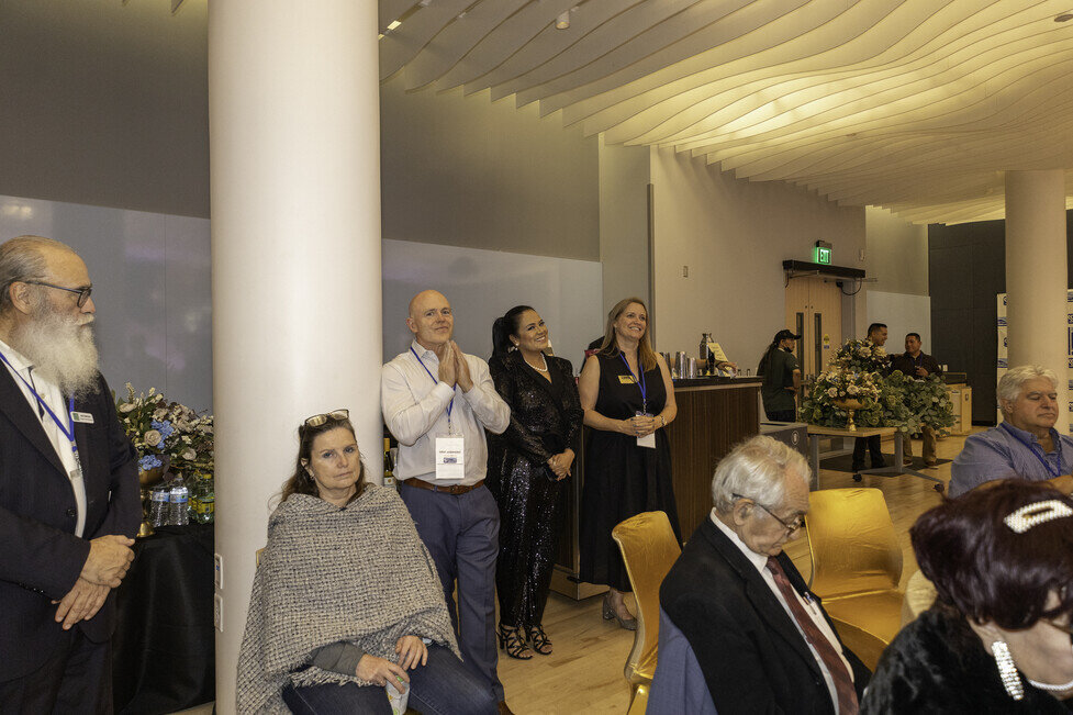 a group of people standing in a room