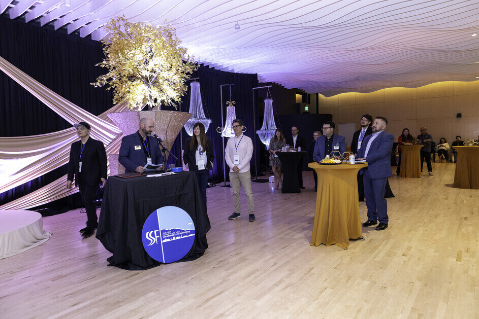 a group of people standing in a room