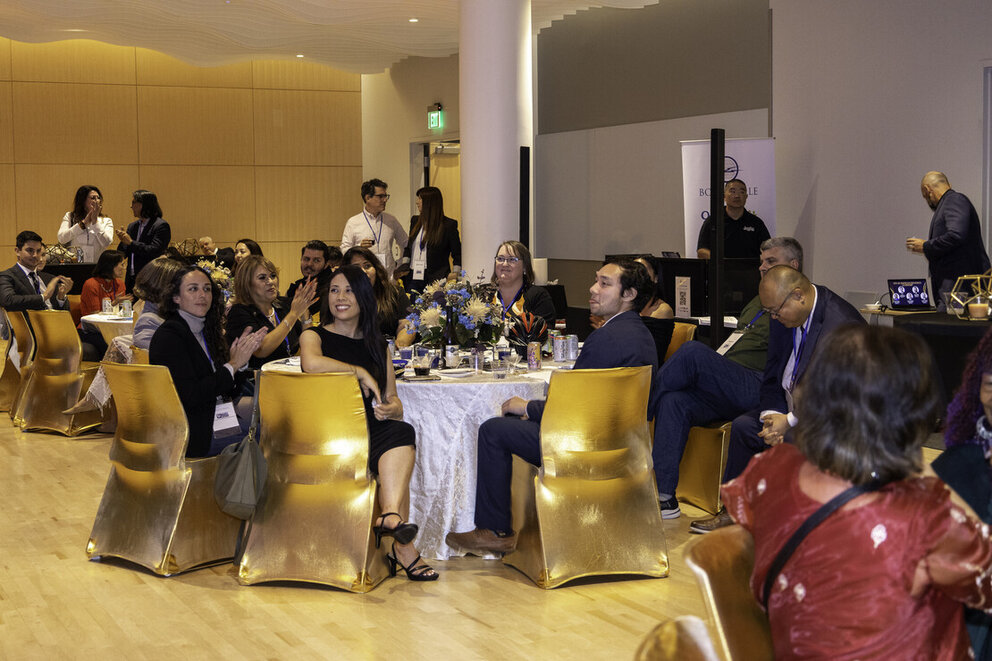 a group of people sitting at a table
