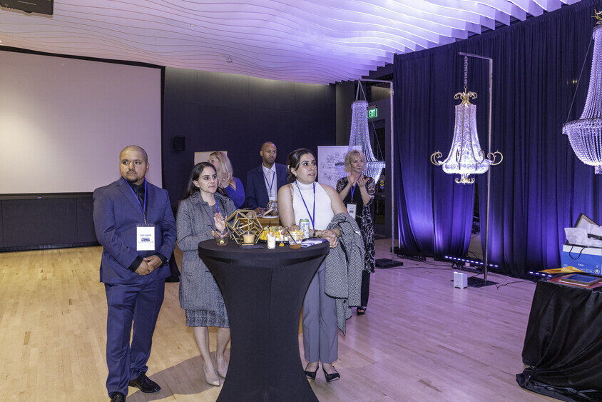 a group of people standing in a room