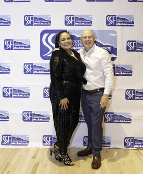 a man and woman posing for a picture