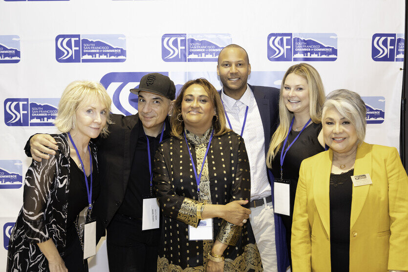 a group of people posing for a photo