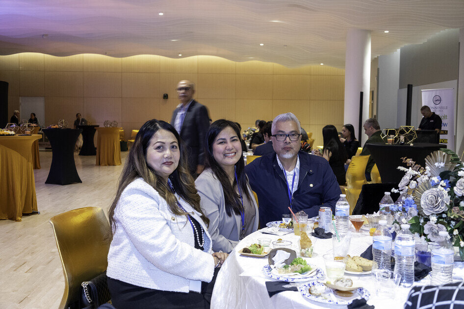 a group of people sitting at a table