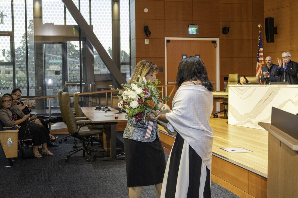 a woman holding a bouquet of flowers