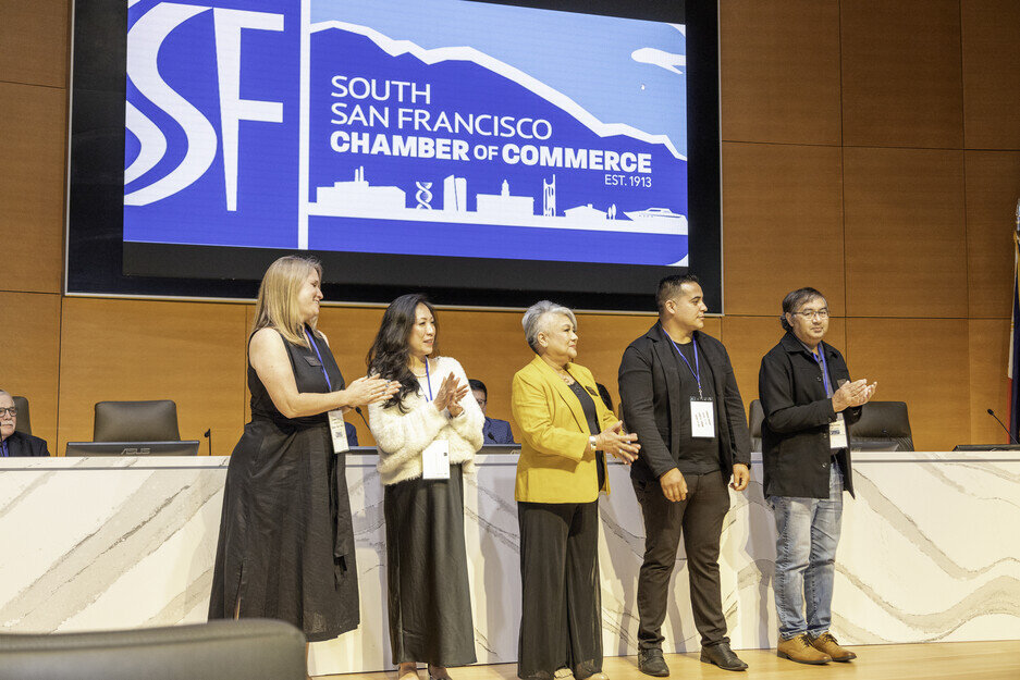 a group of people standing on a stage