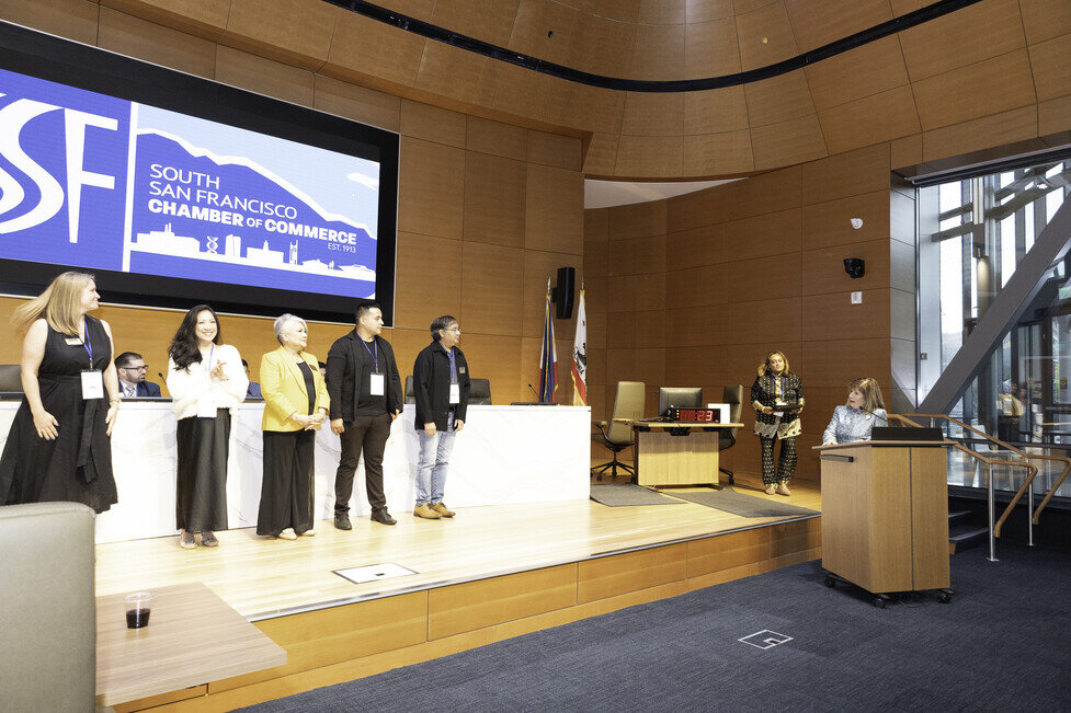 a group of people standing on a stage