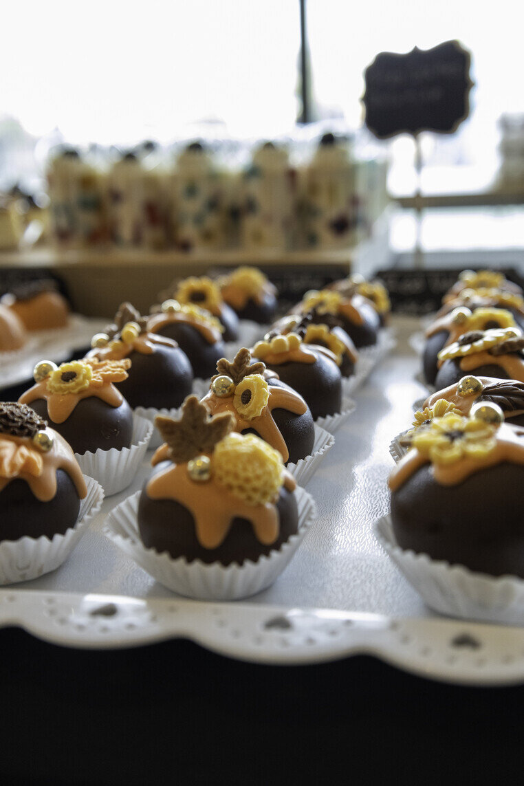 a group of chocolate candies with flowers
