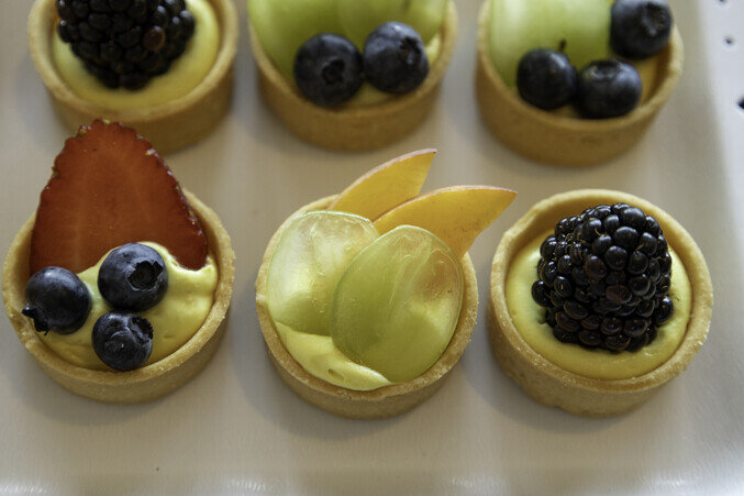 a group of fruit tarts